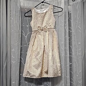 American Princess Gold dress with crystal stones around waist and bow. Size 8